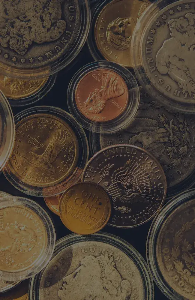 Photo from above of various encased numismatic coins.